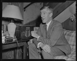 Leverett Saltonstall sitting on the couch and listening to the radio