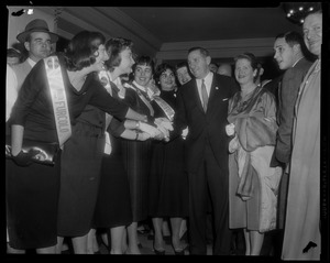 Foster Furcolo and wife Kay shake hands with female supporters while campaigning for governor