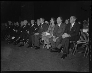 Foster Furcolo (far right) and wife Kay (third from left) sitting in audience with others