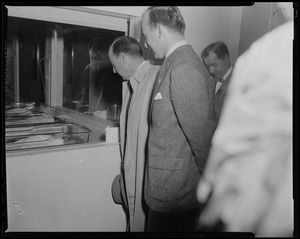 Adlai Stevenson and others looking into the hospital nursery