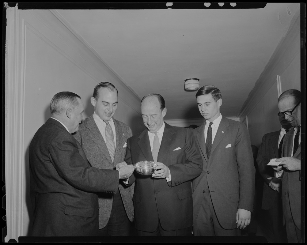 Adlai Stevenson, center, holding silver baby porringer with sons Adlai Stevenson III (on his right) and John Fell Stevenson (on his left)