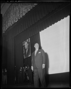 Adlai Stevenson standing on stage