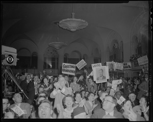 Adlai Stevenson supporters at an event in a large room with CBS news camera on left