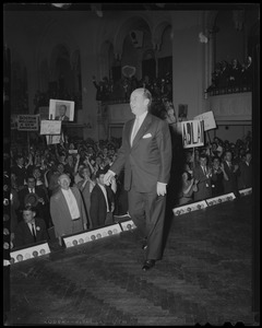 Adlai Stevenson walking on stage at an event