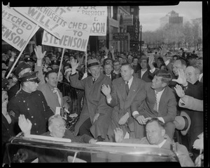 Men in convertible, including John F. Kennedy