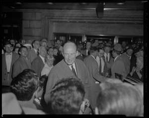 Adlai Stevenson outside the Statler Hotel, surrounded by a crowd of supporters