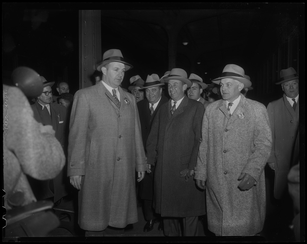 Paul Dever and Adlai Stevenson, with two others on either side in overcoats and hats