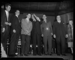 John F. Kennedy, Borden Stevenson, John Fell Stevenson, Adlai Stevenson II, Adlai Stevenson III and Paul Dever and a woman on stage