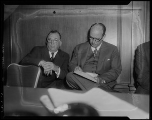 Adlai Stevenson and another man seated