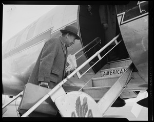 Adlai Stevenson walking up steps into the American Airlines airplane