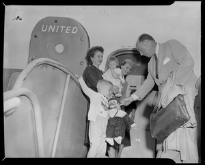 Adlai Stevenson with family, walking off United flight