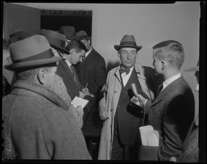 Adlai Stevenson talking with reporters
