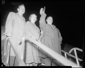 Adlai Stevenson III, Nancy Anderson Stevenson and Adlai Stevenson II on airplane stairs