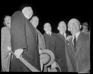 Adlai Stevenson, Paul Dever, Mayor John B. Hynes and two others on stairs, with Nancy Anderson Stevenson behind them