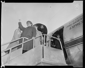 Adlai Stevenson standing on stairs of "Stevenson Presidential Express" airplane