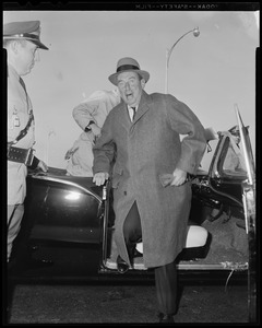 Adlai Stevenson getting out of a car