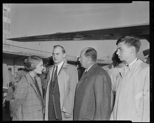 Nancy Anderson Stevenson, Adlai Stevenson III, Adlai Stevenson II and John Fell Stevenson standing outside by an airplane