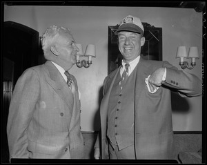 Adlai Stevenson and another man standing in a room