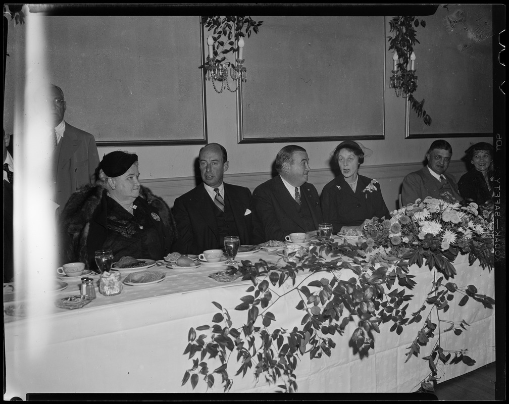 Adlai Stevenson, Paul Dever and four others seated at a dinner table