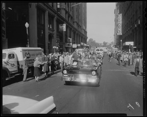 Mayor John B. Hynes and Adlai Stevenson sitting in the front car during a parade