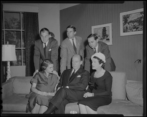 Nancy Anderson Stevenson, Adlai Stevenson, and Rose Kennedy seated on couch with Adlai Stevenson III, John Fell Stevenson, and Borden Stevenson standing behind them