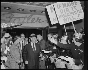 Adlai Stevenson walking by a crowd of supporters