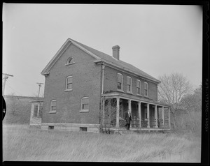 Man walking out of a house