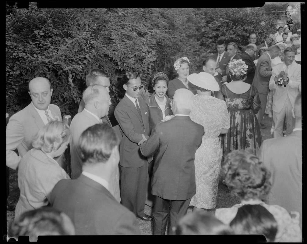 King Bhumibol Adulyadej and Queen Sirikit of Thailand greeting people in a receiving line