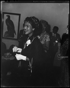 Queen Sirikit of Thailand holding a glass