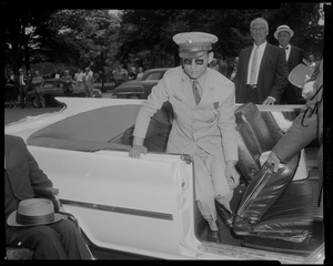 King Bhumibol Adulyadej exiting a vehicle