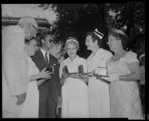 King Bhumibol Adulyadej with a group of nurses