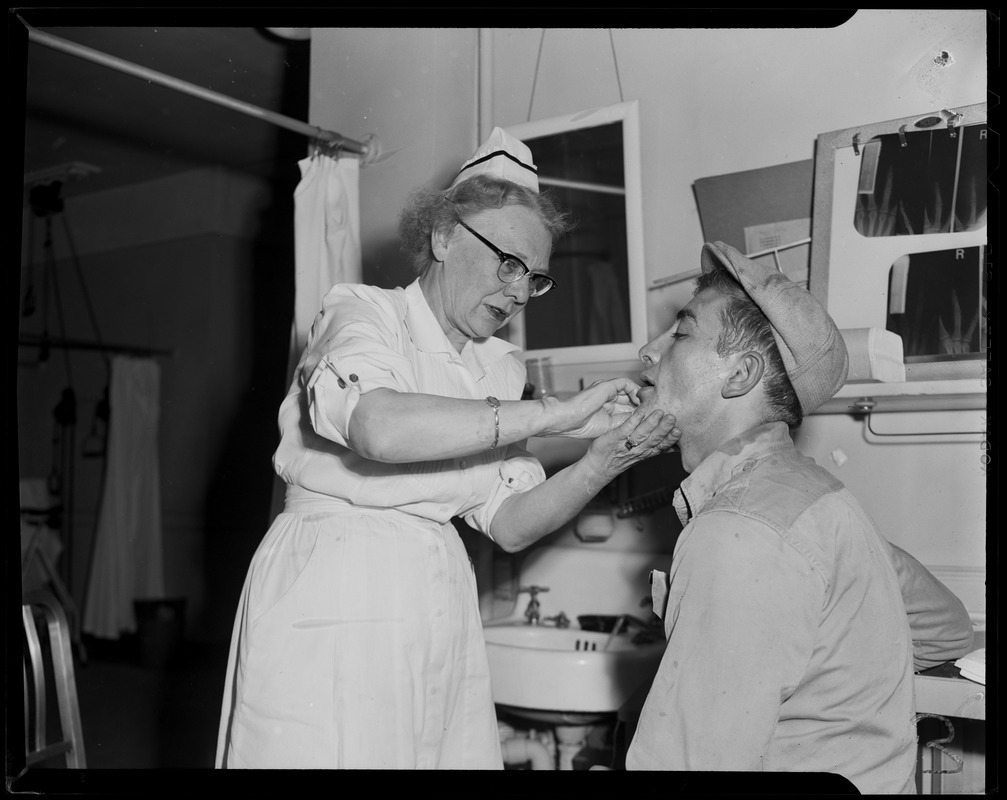 Nurse checking a man's face