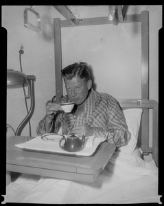 Arthur Godfrey sipping tea