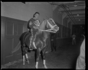 Arthur Godfrey sitting atop his horse "Goldie" for the Rodeo at the Boston Garden