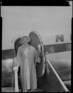Shirley Booth in front of Northeast Airlines plane