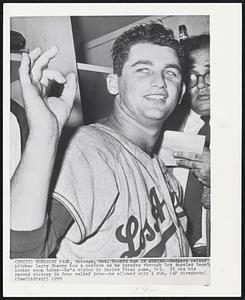 Big Man in Series--Dodgers relief pitcher Larry Sherry has a gesture as he parades through Los Angeles team’s locker room today--he’s victor in Series final game, 9-3. It was his second victory in four relief jobs--he allowed only 1 run.