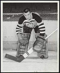 Bruins Goalie Don Simmons, shown without his new protective mask, is doing a better job in the nets since adopting the facepiece, according to Coach Milt Schmidt, who should know.
