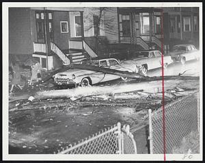 Storm Rakes City-This huge elm was toppled across Hollander street, Roxbury, as winds stronger than 60 miles an hour blew heavy, tropical rains through eastern Massachusetts, causing widespread damage and some power failures.