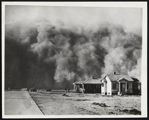 When The Dust Storms Blew. A recurrence of the dust storms, such as this one which occurred in the Spring of 1937, is feared in the southwestern portions of the Great Plans as a result of the persistent dry weather this Fall. The U.S. soil conservation service says dust blowing probably will be worse during the next great drought on the plains because much of the land that blew before has not recovered from the damage. This 1937 picture shows the dust storm approaching Springfield, Colo. Total darkness lasted about one-half hour.