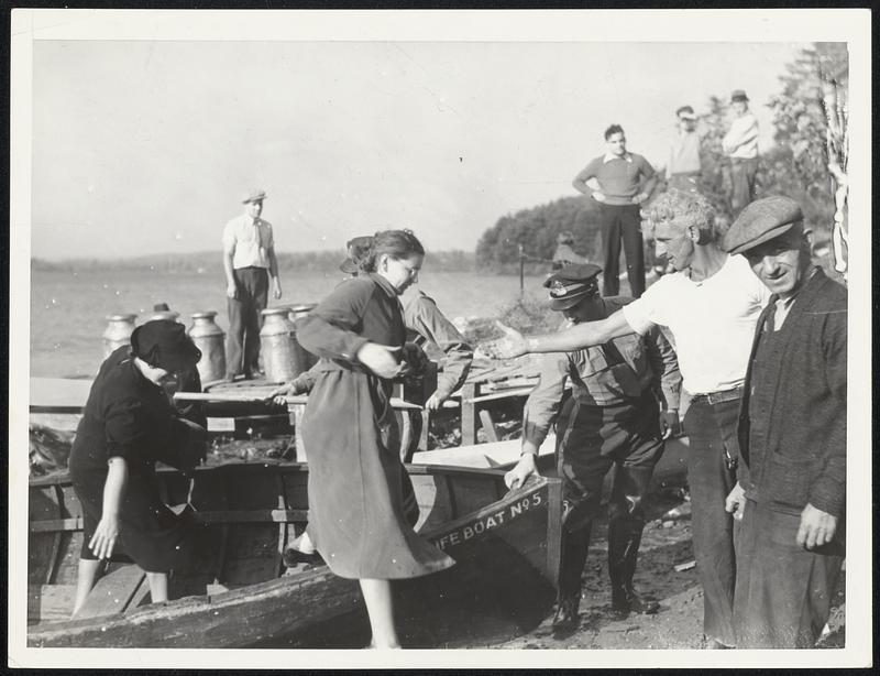 5 --State troopers assisting women out of boats across Lasaway lake into Brookfield. Troopers have M.D.C. boats with outboard motors.