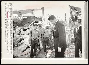 Governor Inspects Damage -- Head bowed, Gov. Ronald Reagan inspects the wreckage of the Veterans Administration Hospital in the Sylmar section of Los Angeles yesterday following the early morning quake. Reagan flew to Los Angeles from Sacramento for a first hand look at the damage.