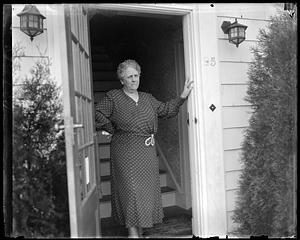 A woman standing in a doorway
