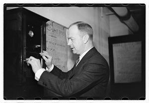 A man demonstrating how to break into a safe