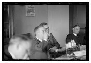 Group of men at table
