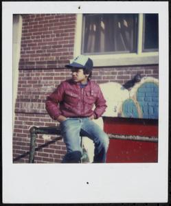 Boy sitting in Newtowne Court