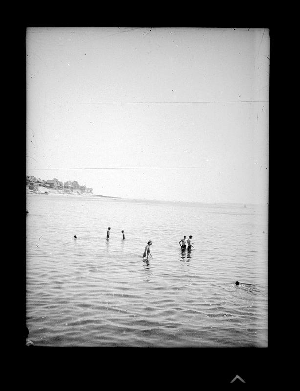People wading through a body of water Digital Commonwealth