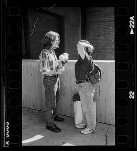 Couple meets with flowers, Boston