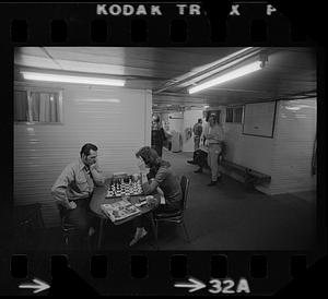 Two people play chess, North Slope camp, Anchorage, Alaska