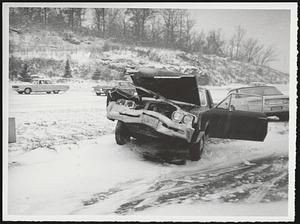 Wrecked car on snowy highway