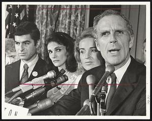 Mayor Kevin White delivers concession speech at Statler Hilton Hotel last night as his running mate, Rep. Michael Dukakis (D...Brookline) and wives of both men look on.